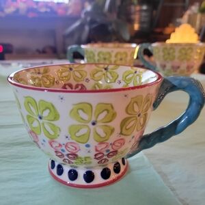 Anthropologie 12 Oz Floral Patterned Teacup with Blue Handle